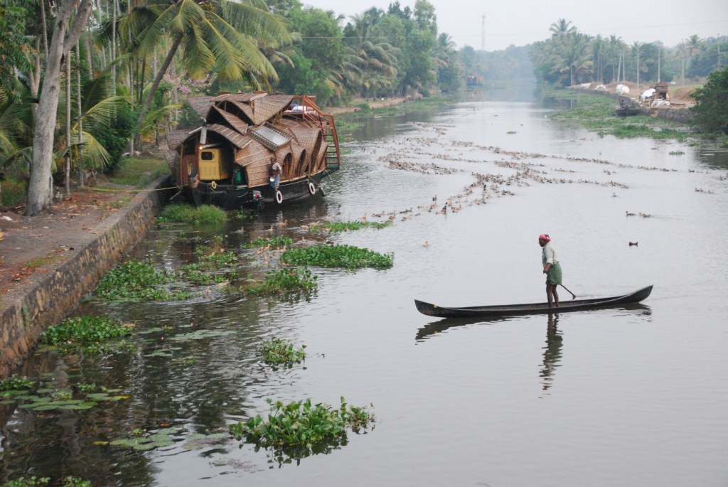 This duck herder - or whatever they call him - very patiently and smoothly moved from side to side of the canal collecting recalcitrant ducks. The houseboat on the left housed the married couple and one single man. It was more interesting to look at than my houseboat, but probably not as much fun.