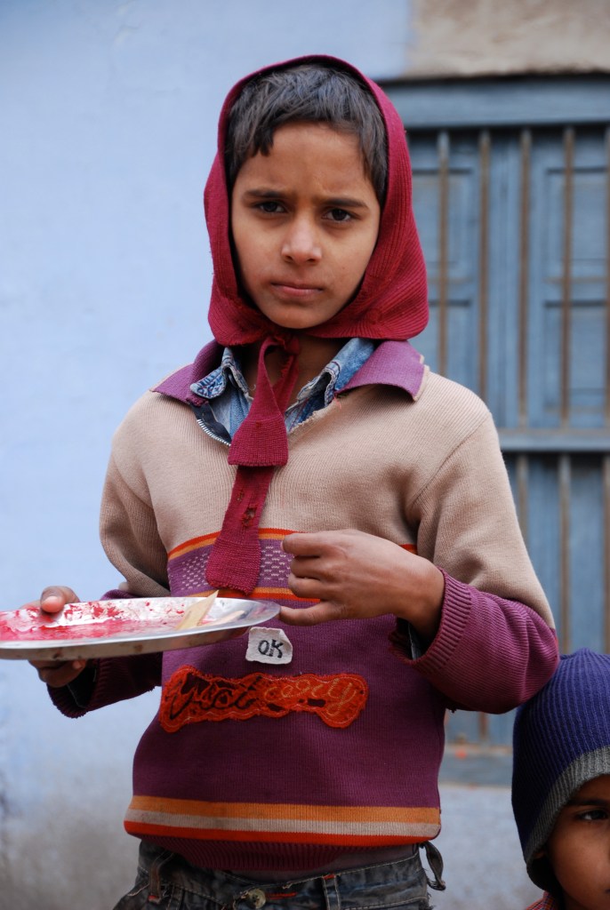 This little boy was dotting foreheads with vermillion and then asking for 10 rupees (2 cents) in exchange. He also posed for photos for 10 rupees, the standard fee. He should have been in school!