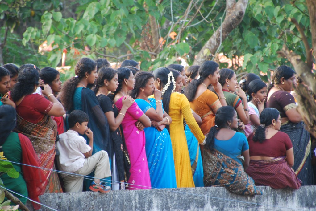 Women and children were packed onto a raised cement platform where they could view the festivities but not be part of the crowd of men around the elephants.