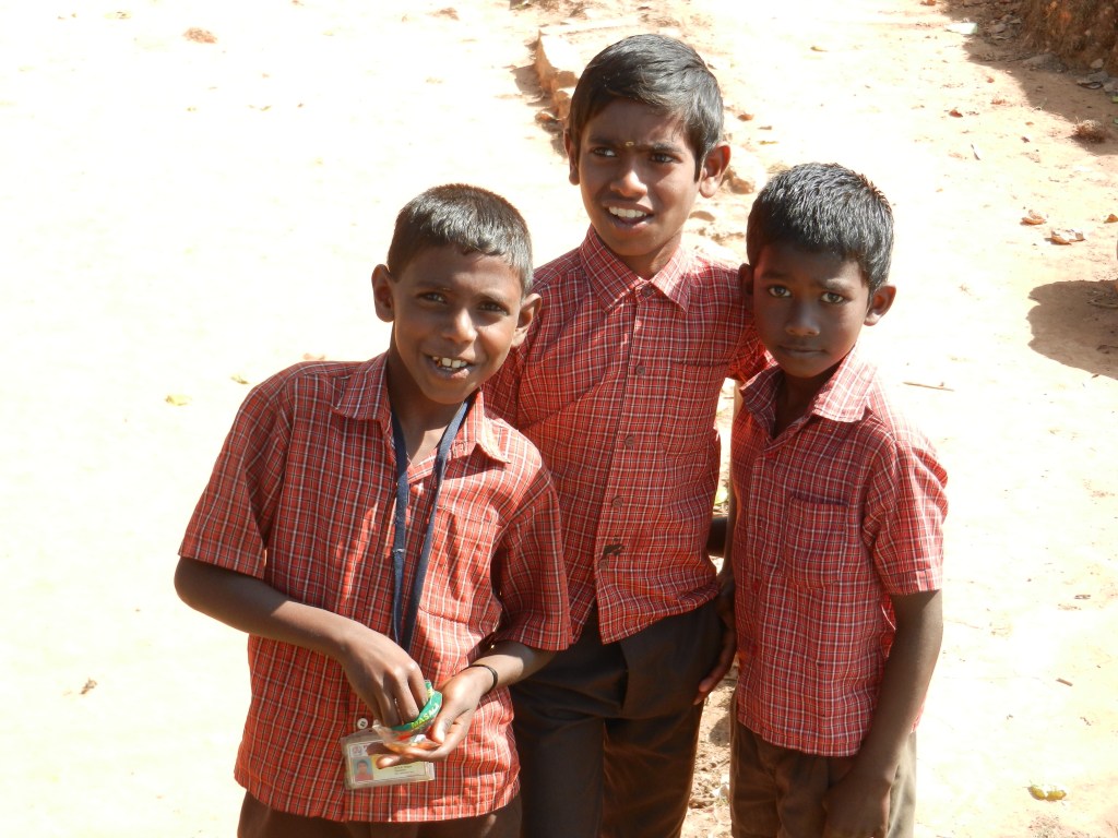These children were happy to have us take their pictures. They had been playing a game of pick-up soccer in a nearby field. We are as much a curiousity for them as they are for us.