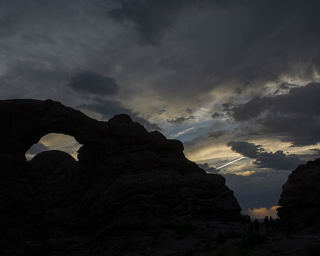 Sunset sky with silhouette of an arch