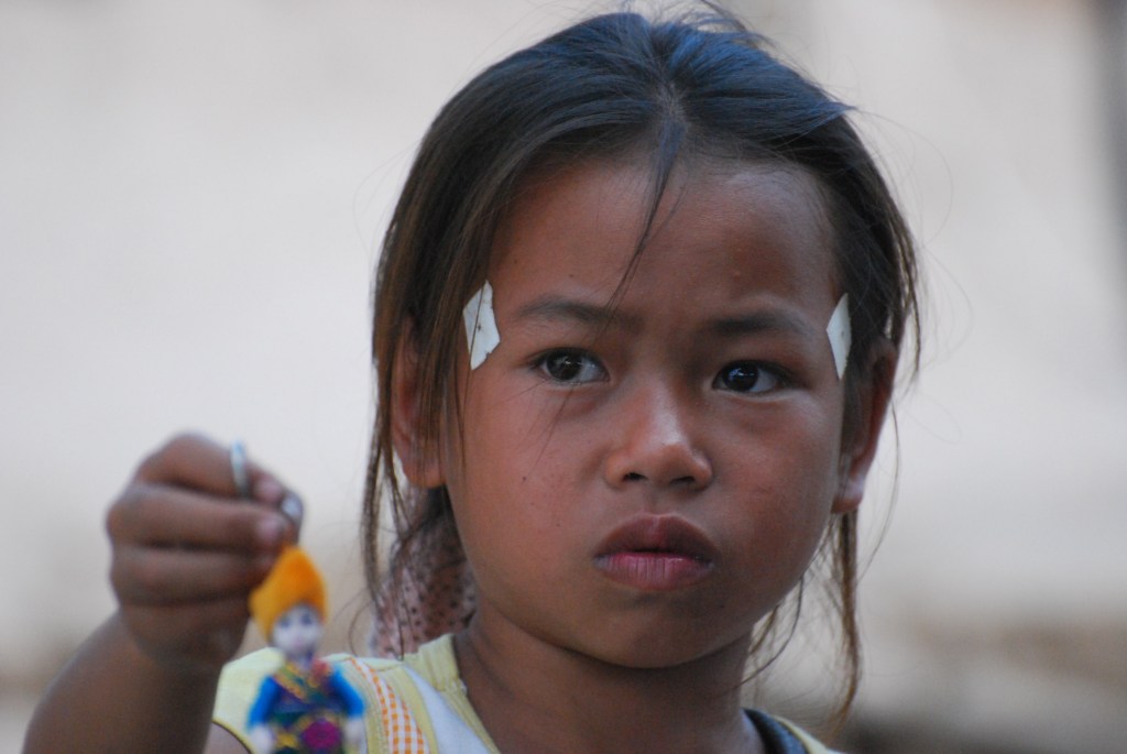 Little girl selling key rings